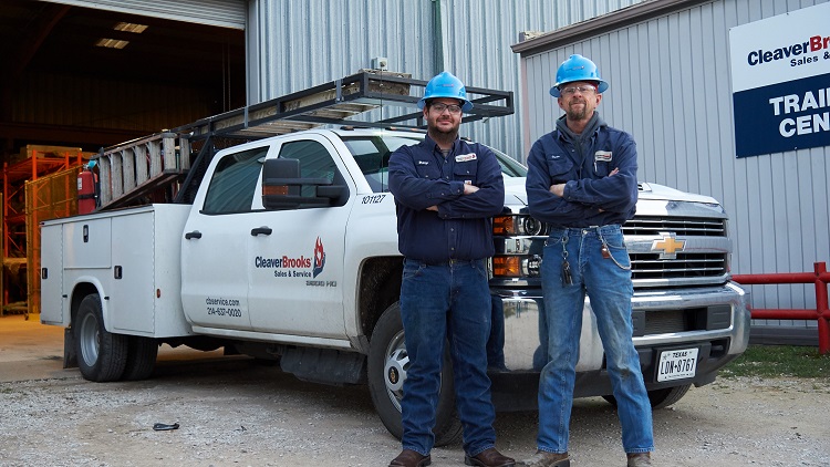 employees next to a truck